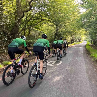 Cyclists riding through a woodland